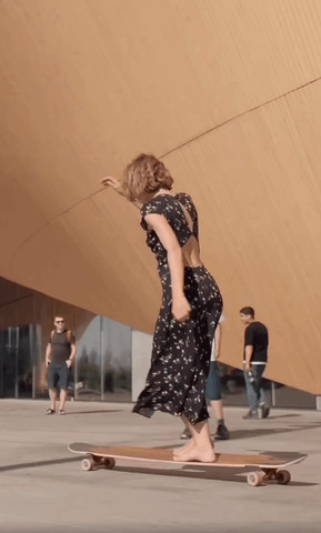 A young and powerful woman skateboarding