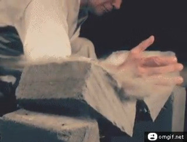 karate chopping a concrete block at slow motion!!!!!