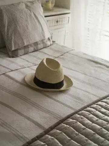 Super Weird Superstitions: Hat on the bed