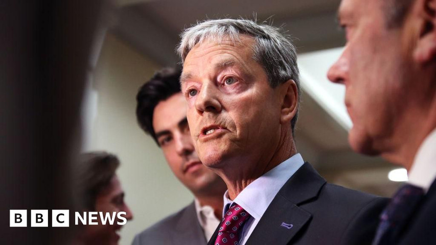 Andrew Bayly: NZ minister resigns for placing hand on staff